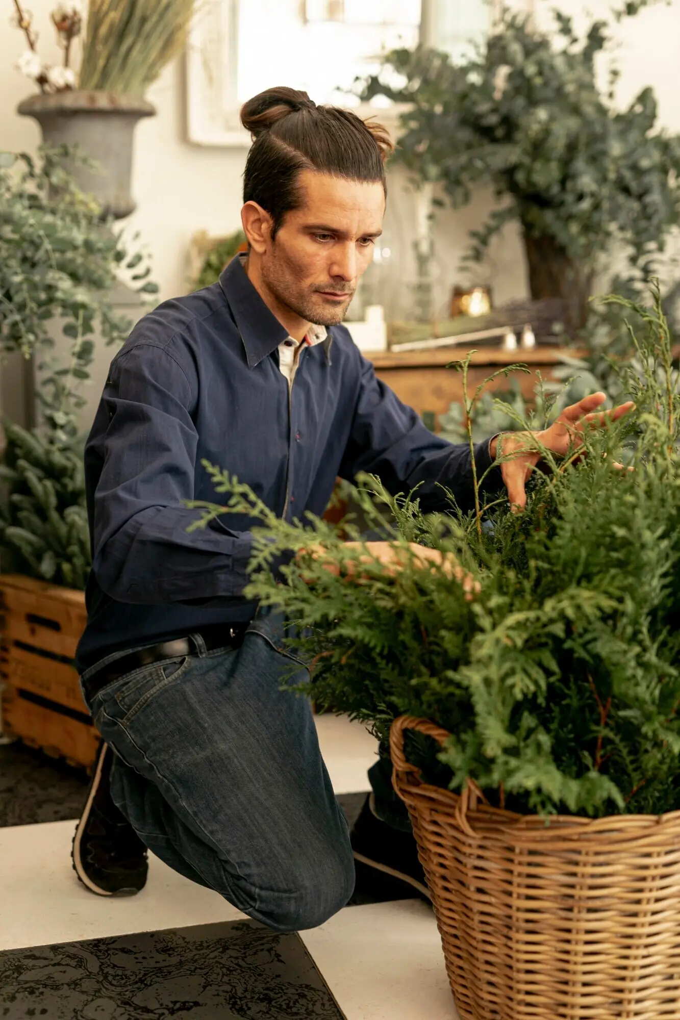 Seasoned florist observing plants