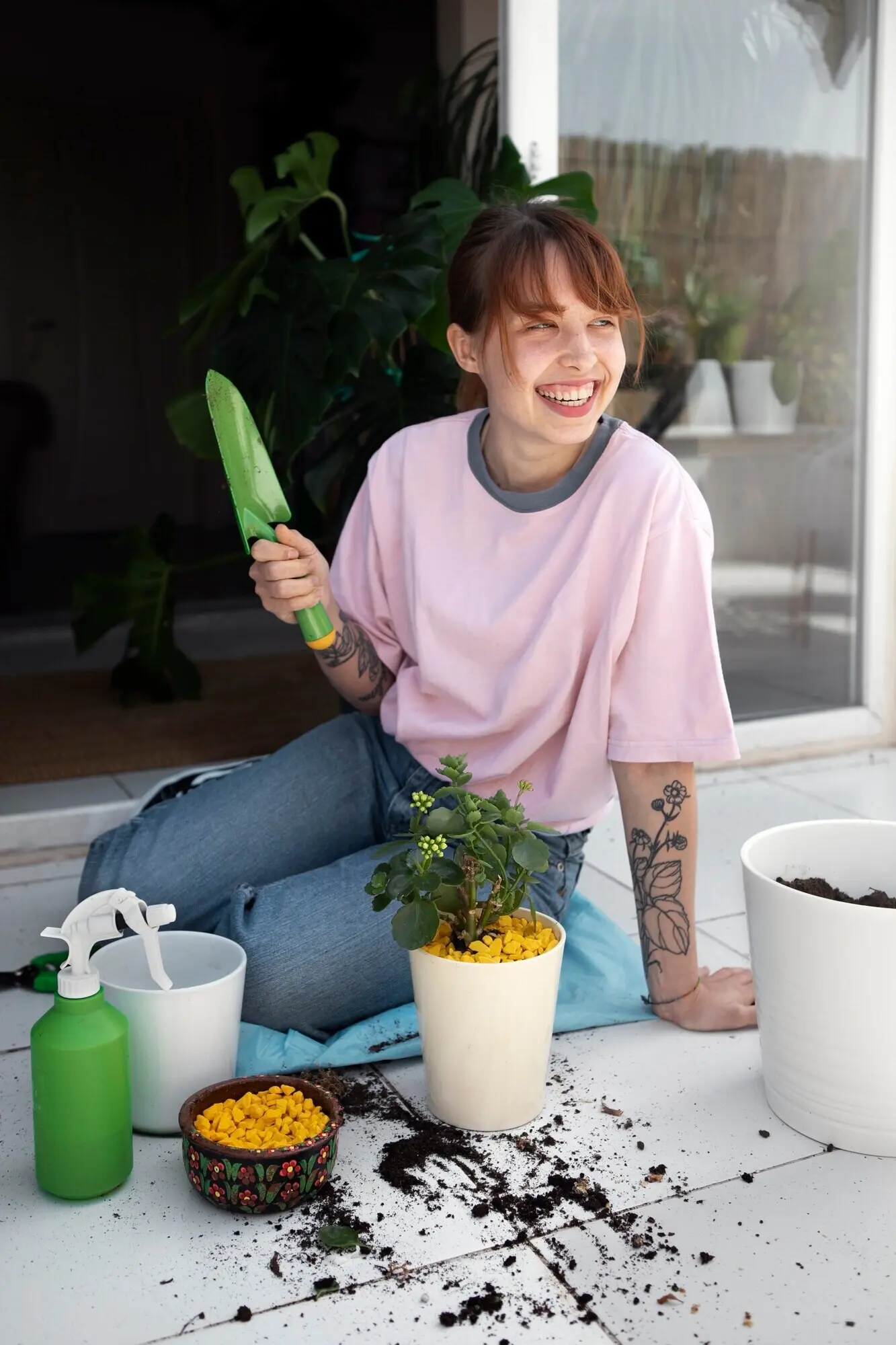 Full-length shot of a smiling woman transplanting plants.